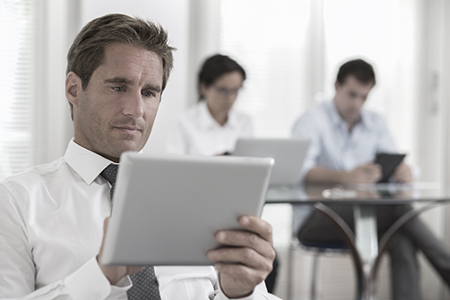 Engineer Boss reads tablet