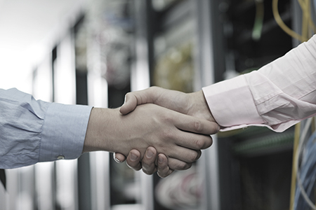 Engineers shake hands
